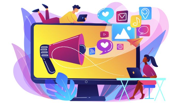 Blog 9 Ilustración de estrategias de marketing outbound con un gran megáfono en la pantalla de un monitor, rodeado de iconos de medios sociales y dos profesionales interactuando con dispositivos digitales.